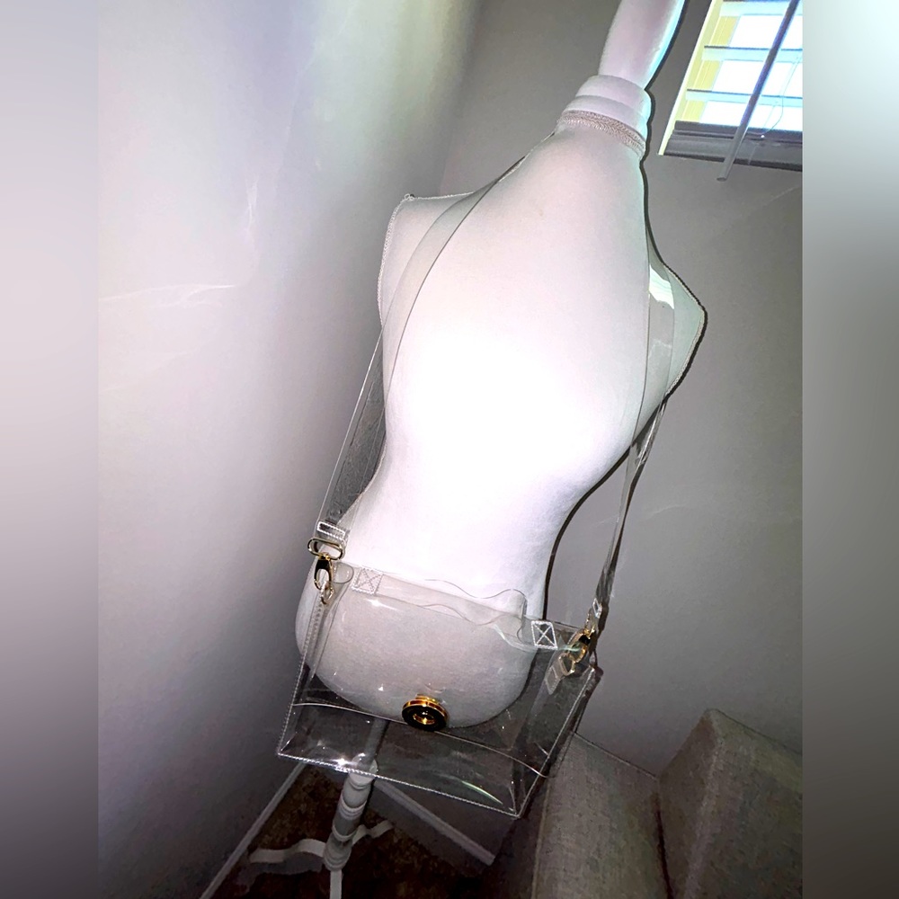 Clear Crossbody bag with removable strap.  carry as handbag. L10in,H 8 in.,W 3in